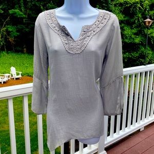 Gray crinkle gauze peasant top with asymmetrical bottom.  Size Small